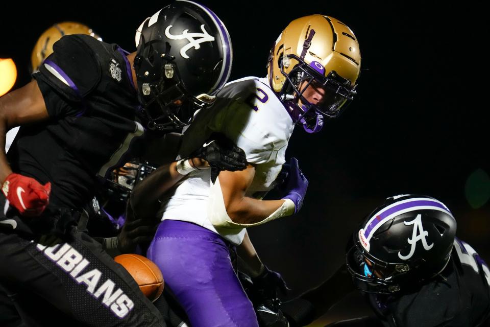 Africentric's Mekhi Johnson strips the ball from Briggs' Isaiah Price during their game Sept. 15.