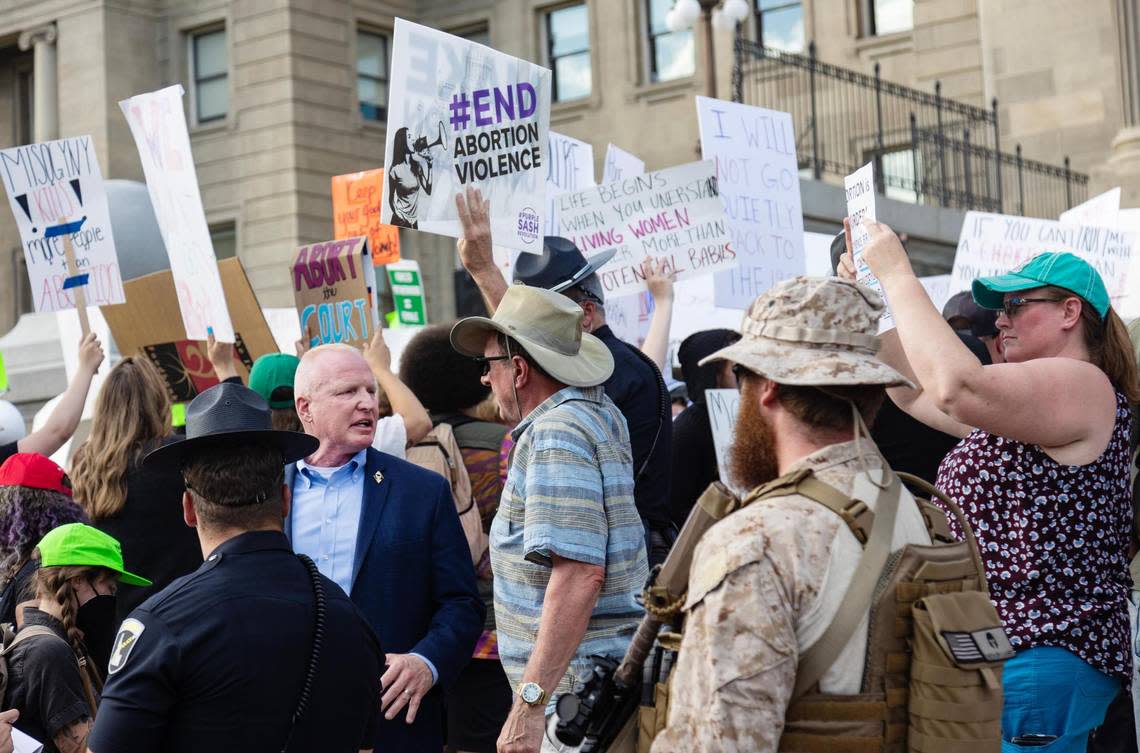 Idaho State Police Lt. Michael Kish, head of Capitol security, monitors an anti-abortion celebration while wearing a light blue shirt and dark blue sport coat.