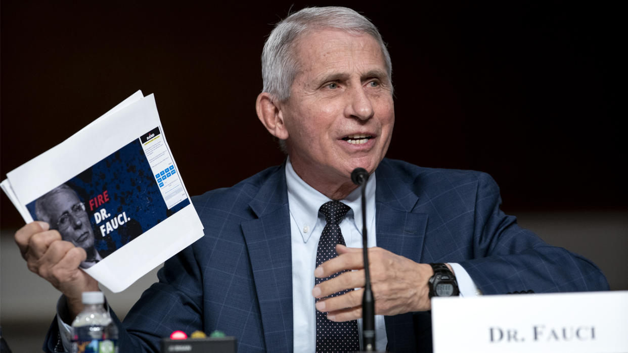 Dr. Anthony Fauci shows a screengrab of a campaign website for Sen. Rand Paul while answering his questions at a Senate Committee on Health, Education, Labor, and Pensions hearing on Capitol Hill on Jan. 11.