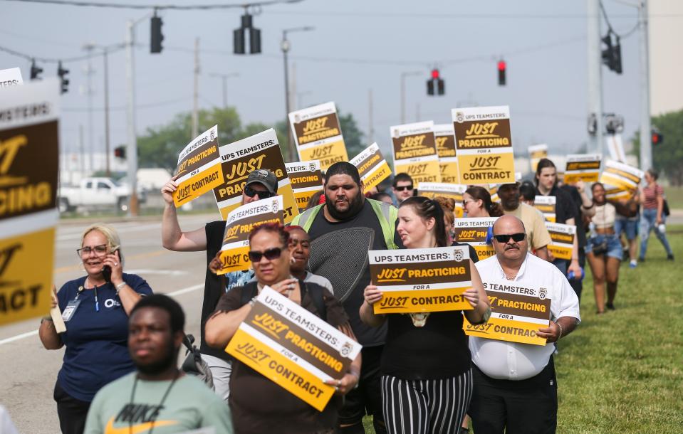 With signs that say "Just Practicing For A Just Contract," around 70 UPS workers and members of the Teamsters Local 89, which represents roughly 10,000 UPS employees in Louisville, practiced strike outside Worldport, the largest sorting and logistics facility in America Wednesday morning in Louisville, Ky. June 28, 2023
