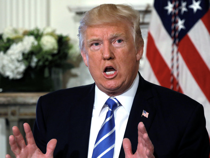 FILE PHOTO: U.S. President Donald Trump speaks to reporters at his golf estate in Bedminster, New Jersey U.S. August 11, 2017.  REUTERS/Jonathan Ernst