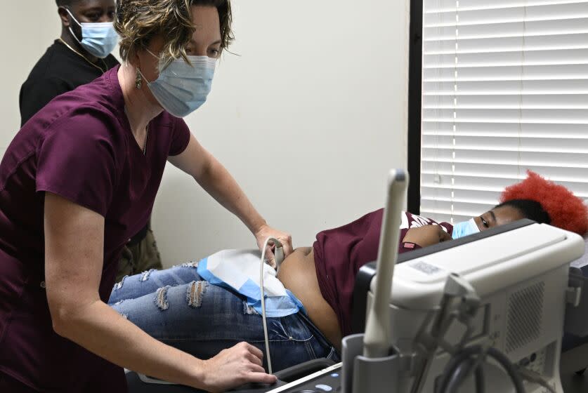 TUSCALOOSA, AL -APRIL 24, 2023: Dr. Leah Torres administers an Ultrasound on a 27-year-old woman who is 10 weeks pregnant at West Alabama Women's Clinic on April 24, 2023 in Tuscaloosa, Alabama. Once the busiest abortion clinic in this Deep South state, the West Alabama Women's Center in Tuscaloosa shut down briefly when Alabama banned all abortions. But it's reopened with a new focus and remains defiant. It's one of the few clinics committed to providing pre-natal care, birth control and miscarriage treatment to low income and uninsured patients in a state with the third highest maternal mortality rate and fifth highest infant death rate in the nation.(Gina Ferazzi / Los Angeles Times)