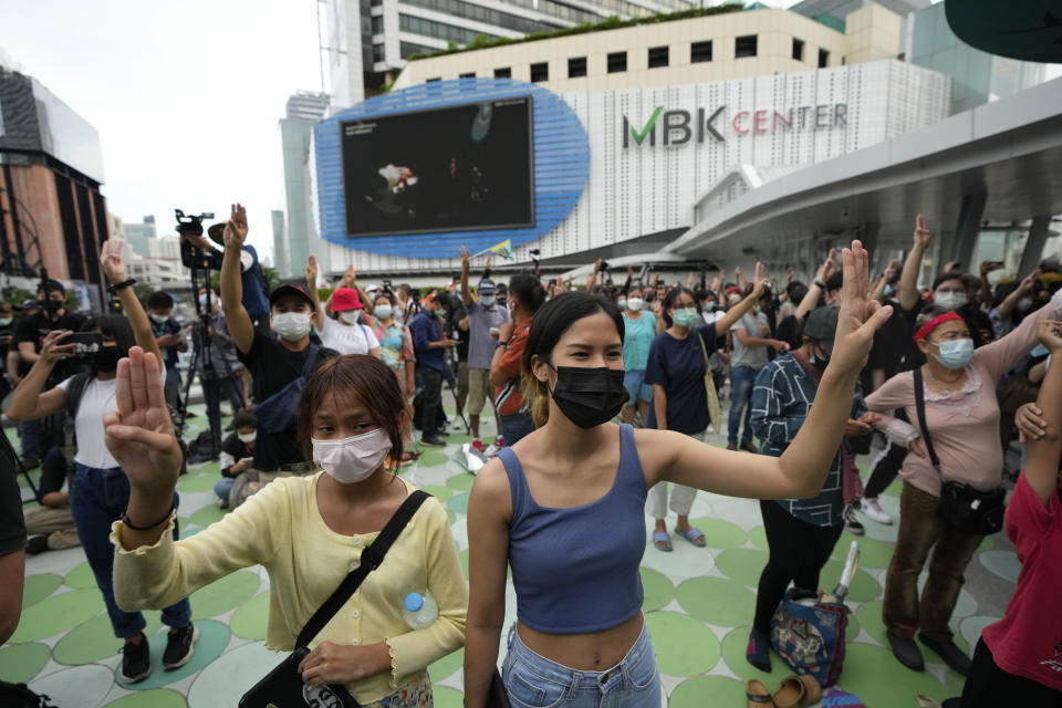 Pro-democracy supporters display the three-finger symbol during a demonstration in Bangkok, Thailand, Thursday, June 24, 2021. Pro-democracy protesters have taken to the streets of Thailand's capital, marking the 89th anniversary of the overthrow of the country's absolute monarchy by renewing their demands that the government step down, the constitution be amended and the monarchy become more accountable. (AP Photo/Sakchai Lalit)