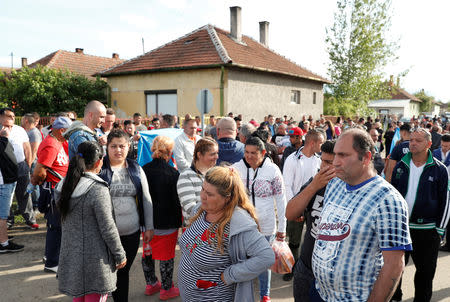 Roma people gather on the outskirts of the town to commemorate the killings of Roma people by right-wing militants in 2009, in Torokszentmiklos, Hungary, May 21, 2019. REUTERS/Bernadett Szabo