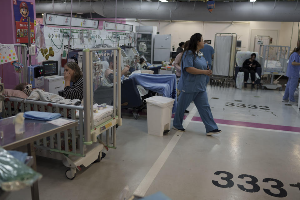 Medical personnel work in a department transferred to underground parking at Rambam Hospital in the northern Israeli city of Haifa, Thursday, Jan. 11, 2024. The prospect of a full-scale war between Israel and Lebanon’s Hezbollah militia terrifies people on both sides of the border, but some see it as an inevitable fallout from Israel’s ongoing war against Hamas in Gaza. (AP Photo/Leo Correa)