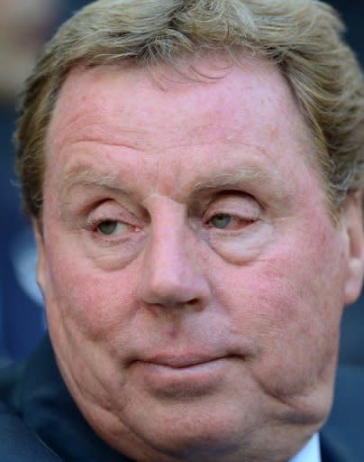 Tottenham Hotspur Manager Harry Redknapp looks on ahead of the the FA Cup semi-final football match between Tottenham Hotspur and Chelsea at Wembley Stadium in London. Redknapp called for the swift introduction of goal-line technology after a key decision went against Spurs in their 5-1 FA Cup semi-final thrashing by Chelsea