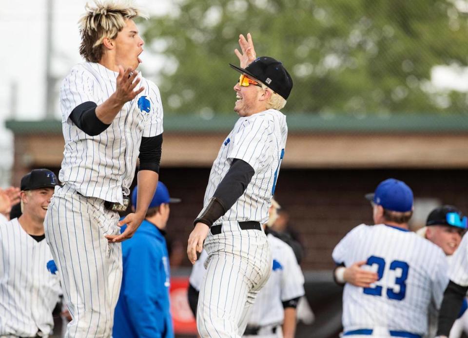 Timberline’s Greyson Shafer and Max Spielman celebrate after winning the 5A baseball state championship game against Eagle at Wolfe Field in Caldwell on Saturday. Timberline beat Eagle 12-4.