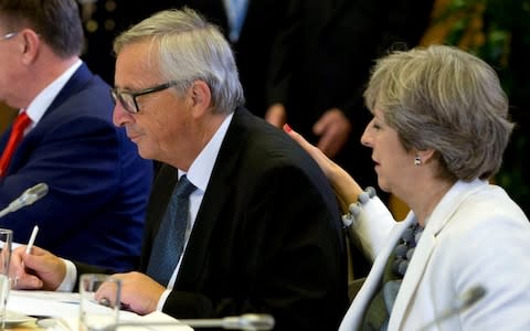 Mrs May and Mr Juncker - Credit: Virginia Mayo /Reuters