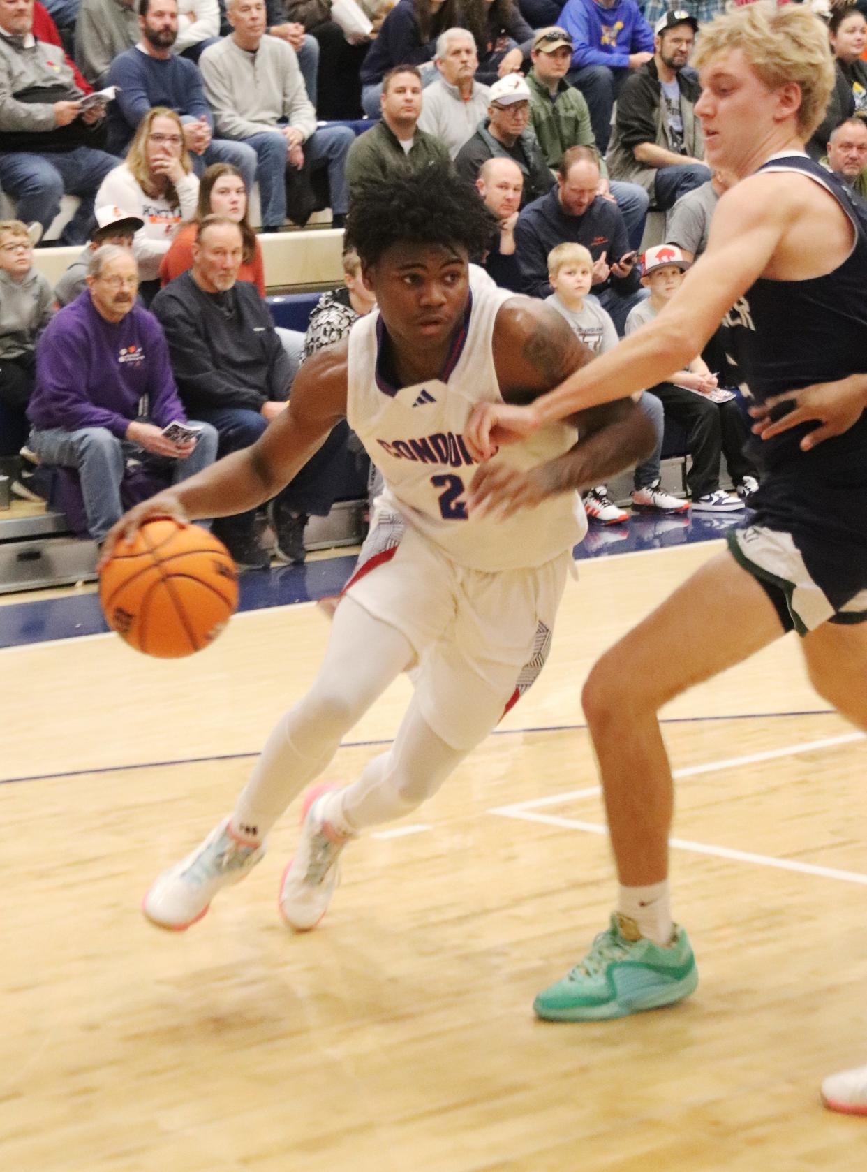 Curie's Carlos Harris III, shown here in the semifinal round against New Trier, came up big in leading the Condors to the title of the 92nd Pontiac Holiday Tournament. Harris was named the AC Williamson Award winner as the most outstanding player in the tournament.