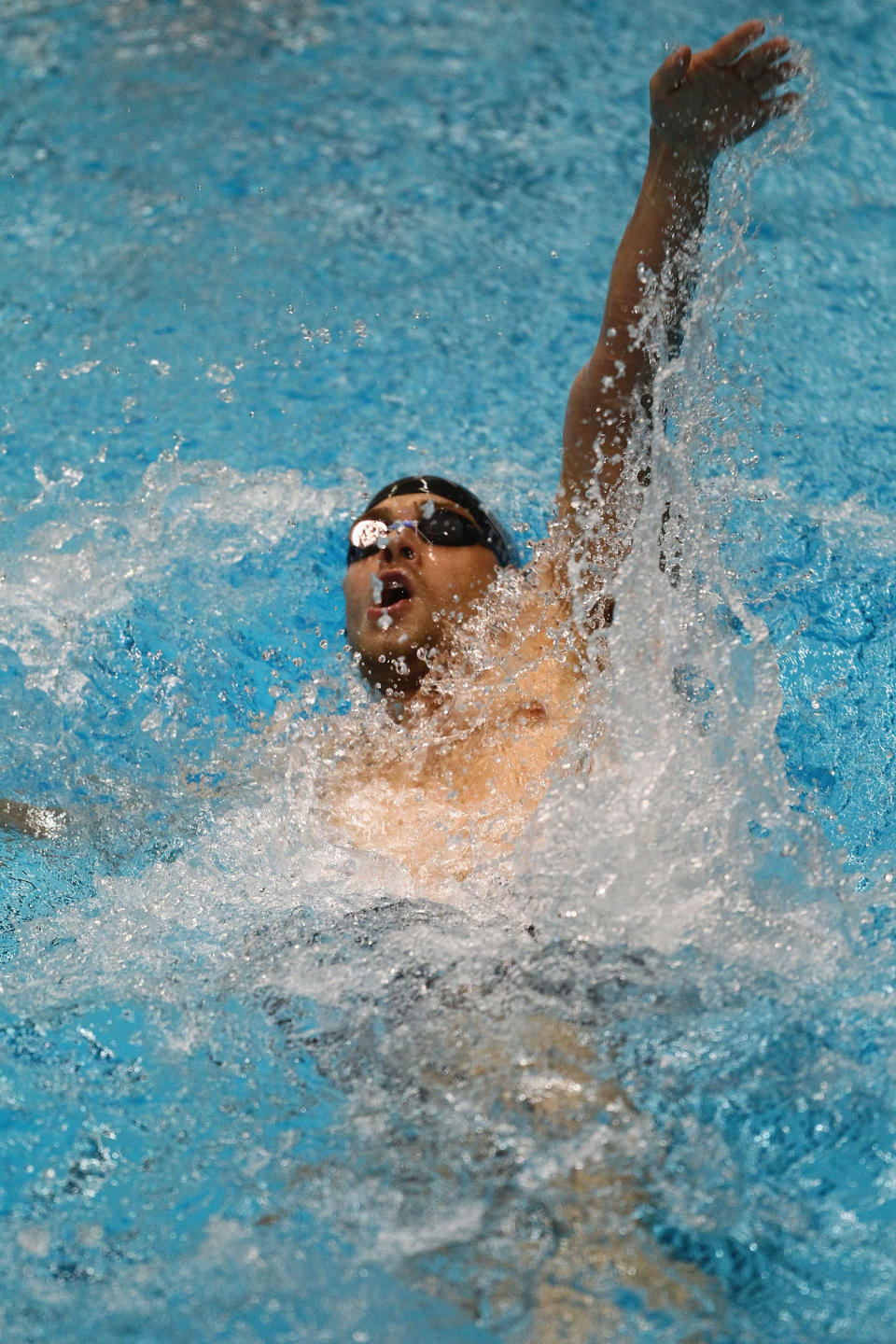 INDIANAPOLIS, IN - MARCH 30: Nick Thoman swims in the men's 200 meter backstroke finals finals during day two of the Indy Grand Prix @ the Nat at the Indiana University Natatorium on March 30, 2012 in Indianapolis, Indiana. (Photo by Dilip Vishwanat/Getty Images)