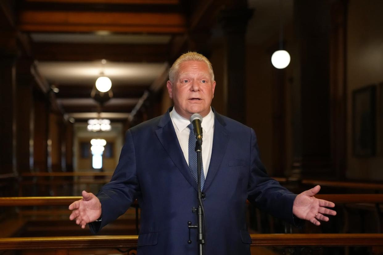 Ontario Premier Doug Ford speaks to journalists at the Queens Park Legislature in Toronto on Friday. (Chris Young/The Canadian Press - image credit)