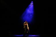 Actors Alistair Brammer and Eva Noblezada perform as Chris and Kim during a photocall for a new production of "Miss Saigon" at the Prince Edward Theatre in London May 19, 2014. The production marks the 25th anniversary of the musical by Claude-Michel Schonberg and Alain Boubil. REUTERS/Luke MacGregor (BRITAIN - Tags: ENTERTAINMENT)