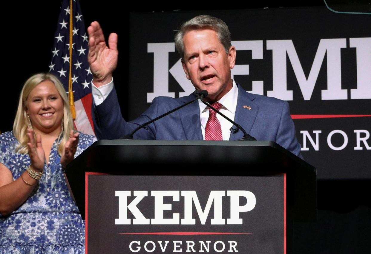 Gov. Brian Kemp at a podium, marked Kemp, Governor.