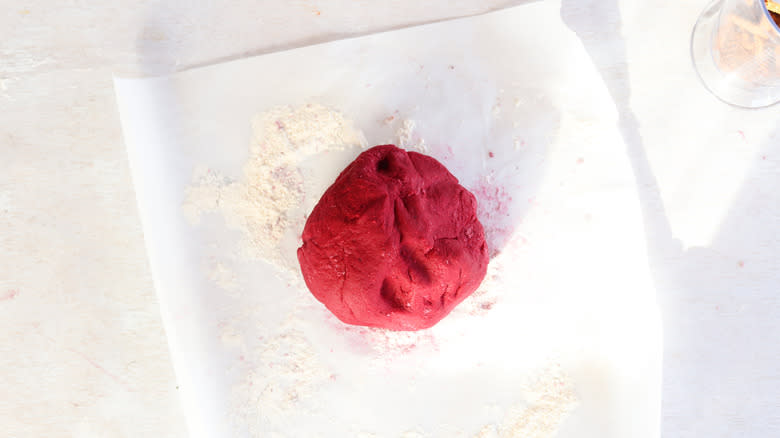 kneaded beet dough on parchment paper