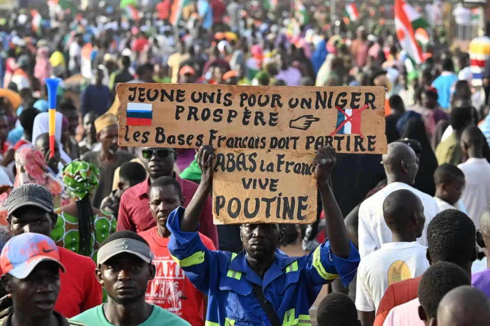 PHOTO: Supporters of Niger's National Council of Safeguard of the Homeland hold the placard 'Youth united for a prosperous Niger' as they protest outside the Niger and French airbase in Niamey on Sept. 16, 2023 to demand the departure of the French army. (AFP via Getty Images)