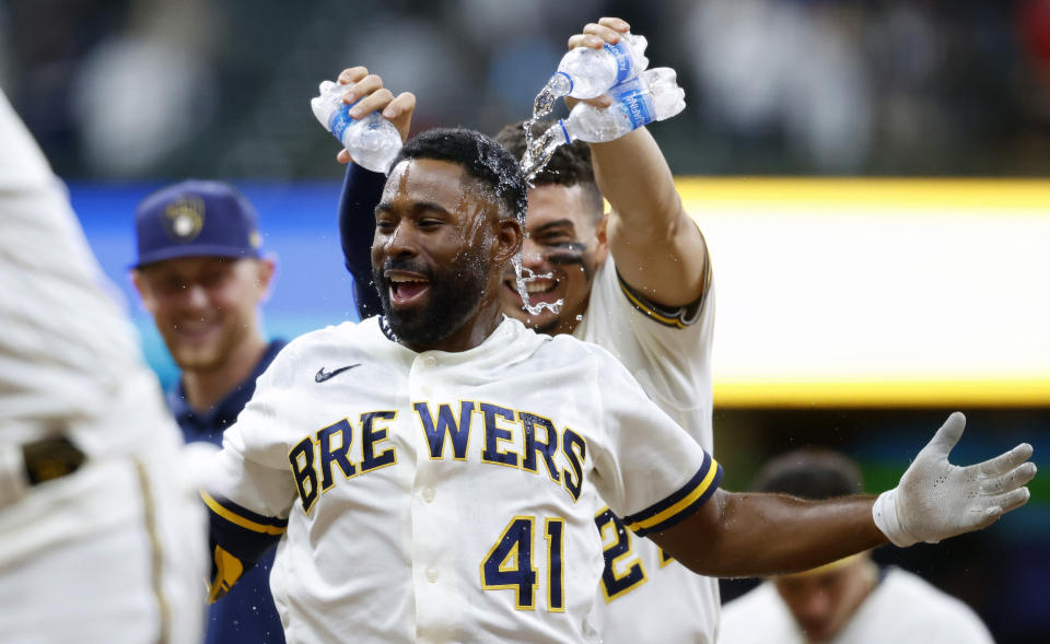 Milwaukee Brewers center fielder Jackie Bradley Jr. (41) celebrates his game winning single against the San Diego Padres in the tenth inning of a baseball game Thursday, May 27, 2021, in Milwaukee. (AP Photo/Jeffrey Phelps)