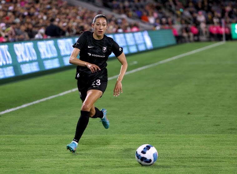 LOS ANGELES, CALIFORNIA - JUNE 07: Christen Press #23 of Angel City FC chases after a ball.