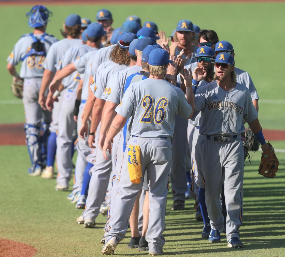 The Angelo State University baseball team celebrates after beating LSC rival Texas A&M-Kingsville in the final game of the South Central Regional Section I Tournament at Foster Field at 1st Community Credit Union Stadium on Saturday, May 21, 2022.