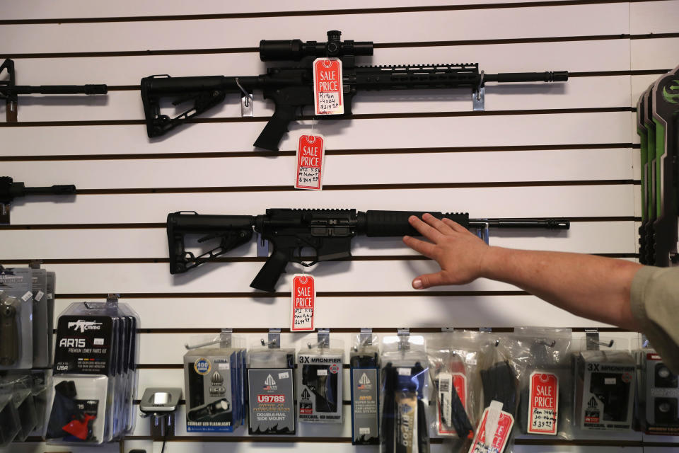 A gun shop owner displays AR-15 "Sport" rifles in 2016 in Benson, Arizona.   (Photo: John Moore/Getty Images)