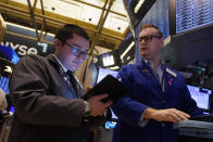 Trader Drew Cohen, left, and specialist Patrick King work on the floor of the New York Stock Exchange, Wednesday, Aug. 7, 2024. (AP Photo/Richard Drew)