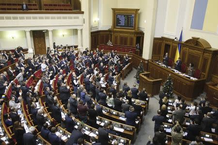 Parliamentary deputies applaud after a renouncing of Ukraine's "non-aligned" status during a session of a parliament in Kiev, December 23, 2014. REUTERS/Alex Kuzmin