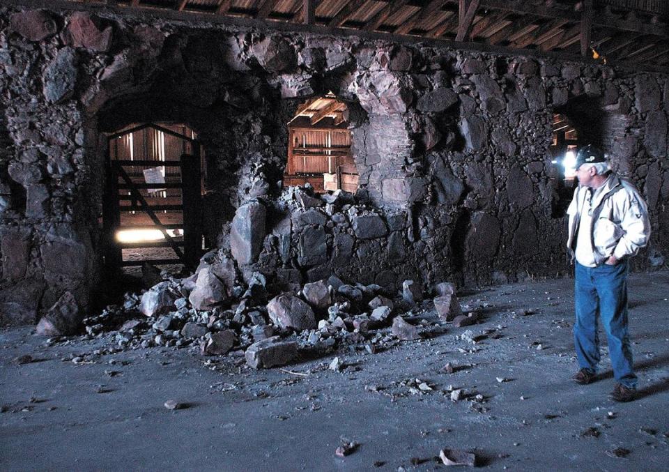 The Asistencia was once a chapel and grainery serving Mission San Luis Obispo from the other side of the grade at Santa Margarita Ranch. The walls were covered with a barn in the early 1900s. The stone work suffered damage in the San Simeon Earthquake. Rob Rossi looks over one of the archways that had rockfall on Jan. 29, 2004.