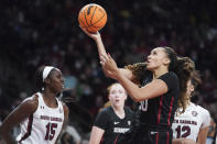 Stanford guard Haley Jones (30) shoots against South Carolina forward Laeticia Amihere (15) during the first half of an NCAA college basketball game Tuesday, Dec. 21, 2021, in Columbia, S.C. (AP Photo/Sean Rayford)