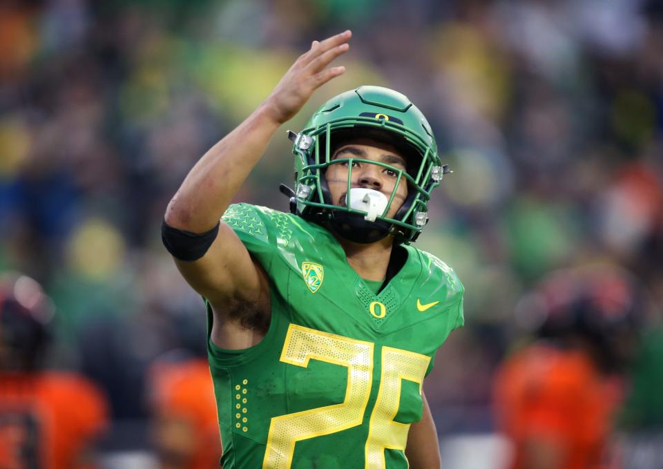 Oregon Travis Dye acknowledge the crowd after scoring against Oregon State in the second half. 