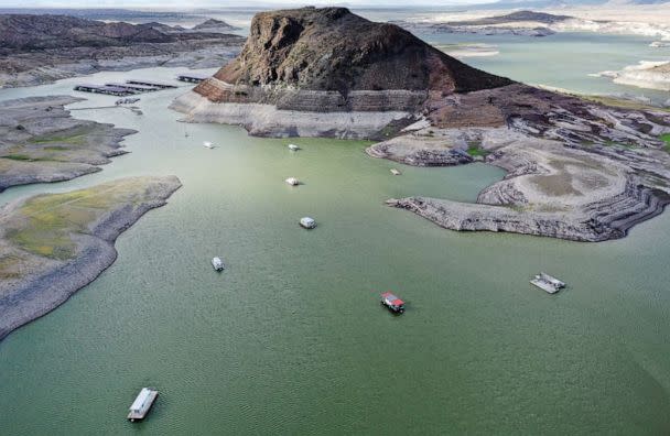 PHOTO: An aerial view of boats anchored near a 'bathtub ring' of mineral deposits left by higher water levels at the drought-stricken Elephant Butte Reservoir on Aug. 16, 2022, near Truth or Consequences, N.M. (Mario Tama/Getty Images)