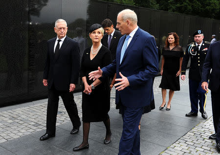 U.S. Secretary of Defence James Mattis, General John Kelly, White House Chief of Staff and Cindy McCain, wife of late Senator John McCain, walk away after laying a ceremonial wreath honouring all whose lives were lost during the Vietnam War at at the Vietnam Veterans Memorial in Washington, U.S., September 1, 2018. REUTERS/Mary F. Calvert