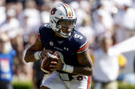 Auburn quarterback Robby Ashford rolls out to pass against Missouri during the second half of an NCAA college football game, Saturday, Sept. 24, 2022 in Auburn, Ala. (AP Photo/Butch Dill)