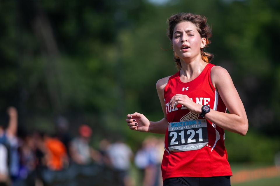 Fox Lane's Morgan Eigel crosses the finish line coming in first place for the girls division 1 race during the Somers Big Red Cross Country Invitational at Somers High School in Lincolndale on Saturday, September 10, 2022.