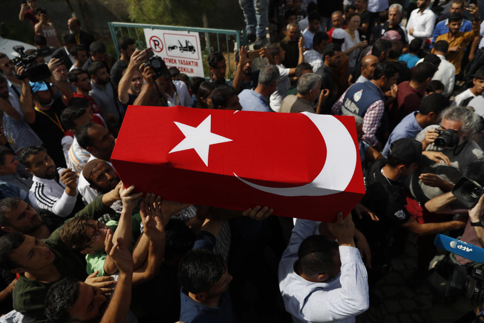 FILE-In this Friday, Oct. 11, 2019 file photo, mourners carry the coffin of ten-month-old Mohammed Omar Saar, killed during incoming shelling from Syria Thursday, in Akcakale, Sanliurfa province, southeastern Turkey, at the border with Syria. Since Turkey announced its incursion into neighbouring Syria to clear out Kurdish fighters last week, patriotic sentiment has run high. (AP Photo/Lefteris Pitarakis, File)