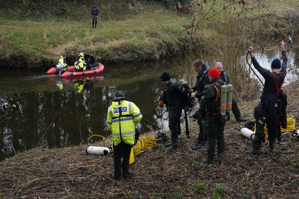 Police search teams at the River Wyre in St Michael’s on Wyre, Lancashire (PA Wire)