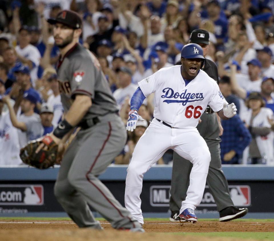 Los Angeles Dodgers’ Yasiel Puig celebrates after a single against the Arizona Diamondbacks during the fourth inning of Game 2 of baseball’s National League Division Series in Los Angeles, Saturday, Oct. 7, 2017. (AP)