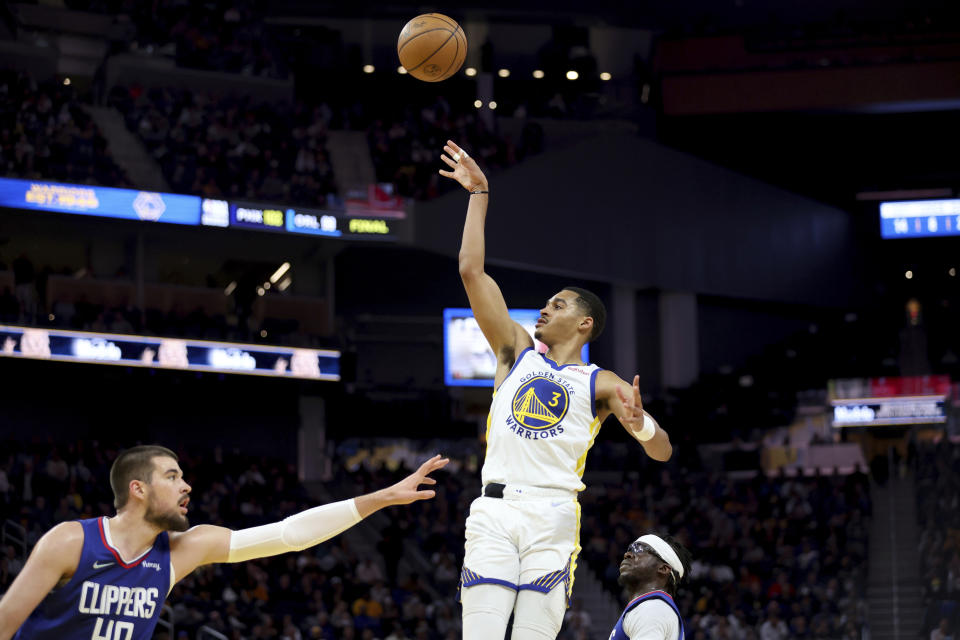 Golden State Warriors guard Jordan Poole (3) shoots against Los Angeles Clippers center Ivica Zubac (40) during the first half of an NBA basketball game in San Francisco, Tuesday, March 8, 2022. (AP Photo/Jed Jacobsohn)