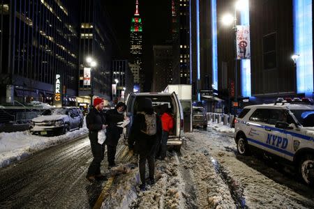 New York City's Coalition for the Homeless delivers food, donated clothing and supplies to homeless people as part of their weekly distribution during winter storm Grayson in Manhattan, New York City, U.S., January 4, 2018. REUTERS/Amr Alfiky