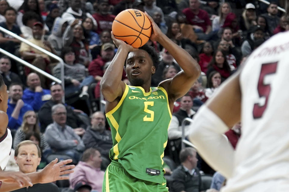 Oregon's Jermaine Couisnard (5) shoots against South Carolina during the second half of a college basketball game in the first round of the NCAA men's tournament Thursday, March 21, 2024, in Pittsburgh. (AP Photo/Matt Freed)