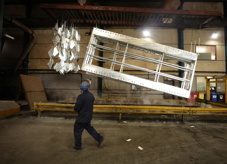 UK economy  A worker walks past freshly galvanised pieces of metal inside the factory of Corbetts The Galvanizers in Telford, Britain, June 28, 2022. REUTERS/Phil Noble