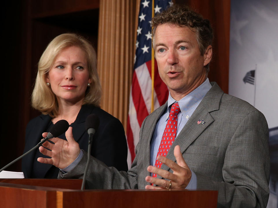 WASHINGTON, DC - JULY 16: U.S. Sen. Rand Paul (R-KY) speaks while U.S. Sen. Kirsten Gillibrand (D-NY) listens during a news conference on sexual assault in the military, July 16, 2013 in Washington, DC. U.S. Sen. Gillibrand announced the support of 34 senators that will co-sponsor her proposal to take the decision whether to prosecute sexual assaults out of the hands of the military chain of command.  (Photo by Mark Wilson/Getty Images)