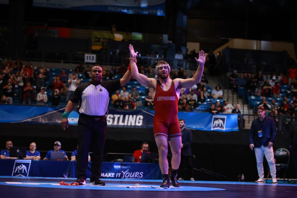 University of Indianapolis redshirt junior and Bloomington South grad Derek Blubaugh has his hand raised after winning the 197-pound title at the NCAA Division II Wrestling Championships in Wichita, Kansas on March 16, 2024.