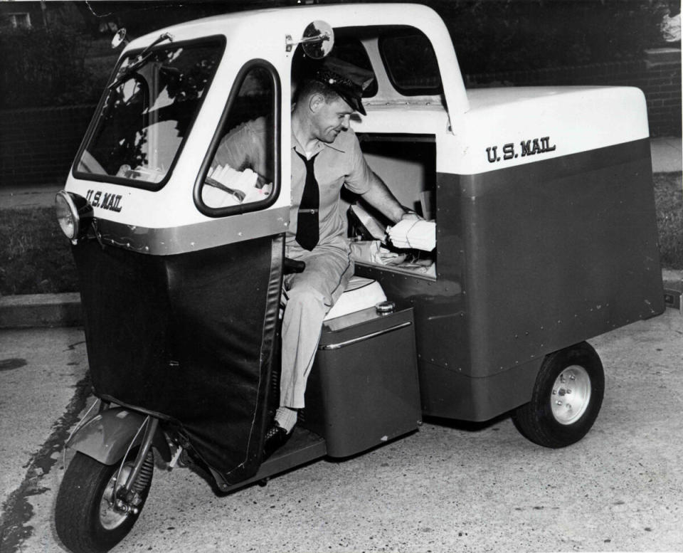 Mailster three wheel vehicle delivering mail in 1955 vintage