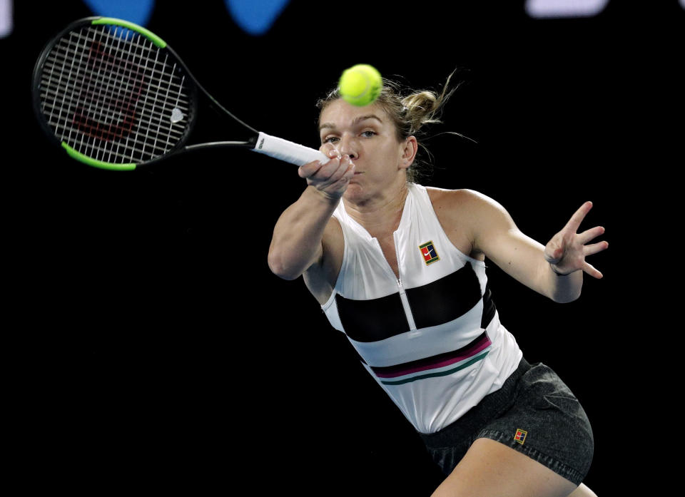 Romania's Simona Halep hits a forehand return to United States' Sofia Kenin during their second round match at the Australian Open tennis championships in Melbourne, Australia, Thursday, Jan. 17, 2019. (AP Photo/Aaron Favila)