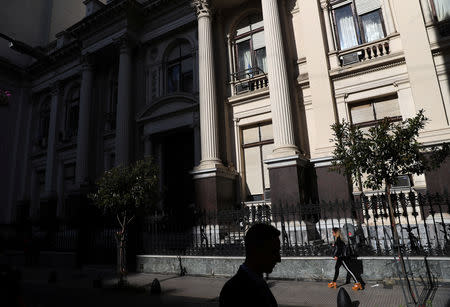 People walk outside the Central Bank in Buenos Aires' financial district, Argentina October 18, 2018. Picture taken October 18, 2018. REUTERS/Marcos Brindicci