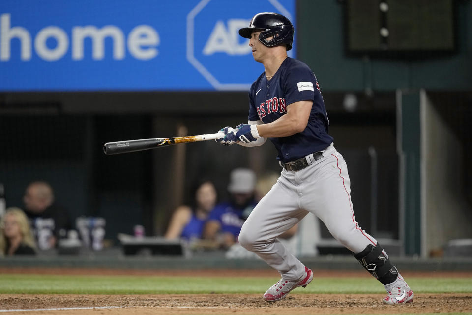 Boston Red Sox's Rob Refsnyder follows through on a two-run single in the eighth inning of a baseball game against the Texas Rangers in Arlington, Texas, Monday, Sept. 18, 2023. Connor Wong and Luis Urias scored on the hit. (AP Photo/Tony Gutierrez)