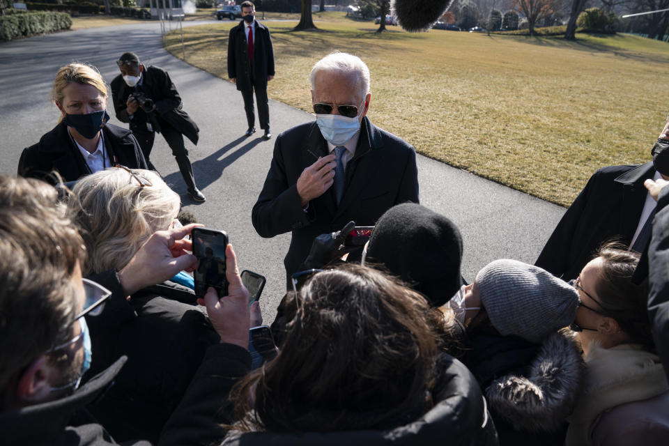 President Joe Biden talks with reporters after arriving on the South Lawn of the White House, Monday, Feb. 8, 2021, in Washington. (AP Photo/Evan Vucci)