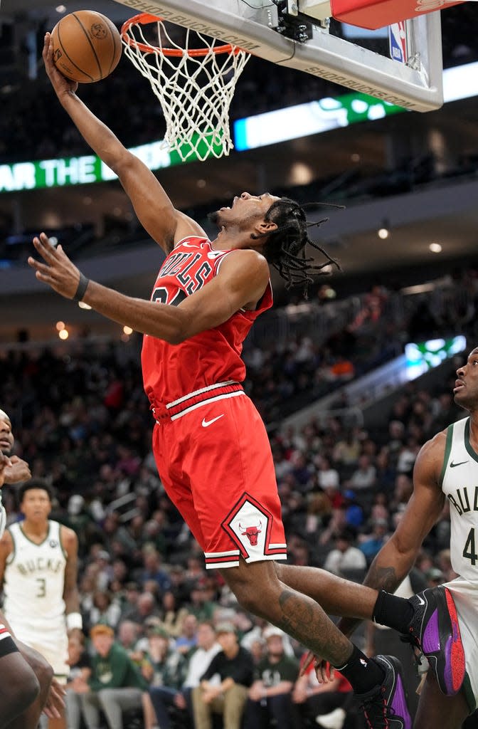 Former Marquette star Justin Lewis scores his first professional bucket on a reverse layup in a preseason game at Fiserv Forum.