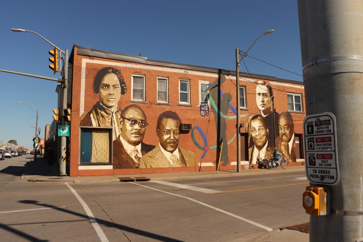 A mural on the McDougall Street Corridor featuring prominent local Black historical figures. (Jennifer La Grassa/CBC - image credit)