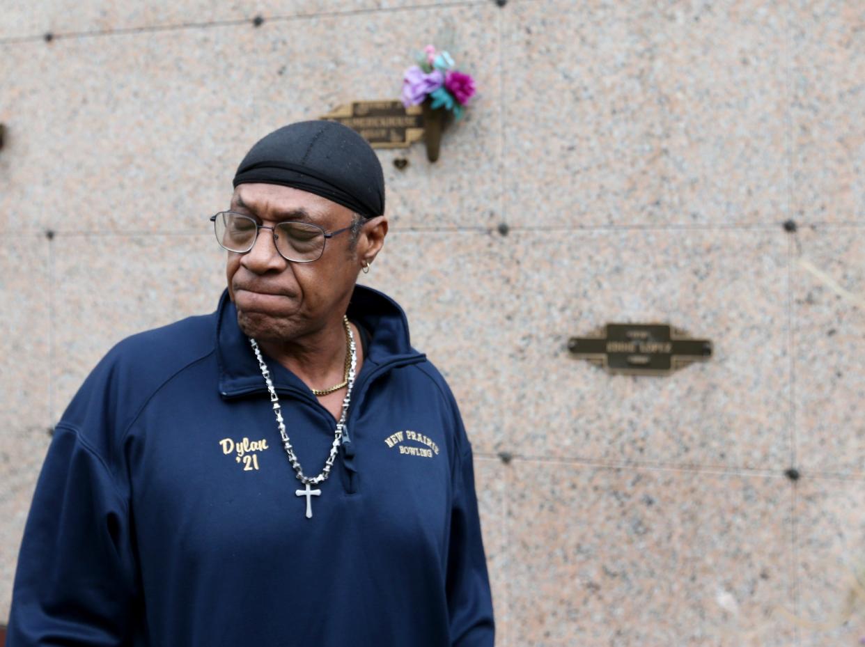 David Smith tears up as he talks of the deaths of his six children in front of the mausoleum at Chapel Hill Memorial Gardens Tuesday, March 26, 2024, in Osceola where the children are interred.