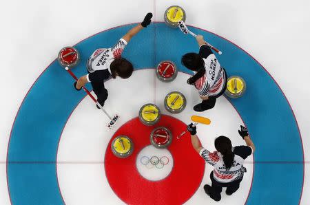 Curling - Pyeongchang 2018 Winter Olympics - Women's Round Robin - U.S. v South Korea - Gangneung Curling Center - Gangneung, South Korea - February 20, 2018 - Kim Kyeong-ae, Kim Seon-yeong and Kim Cho-hi of South Korea. REUTERS/Cathal McNaughton